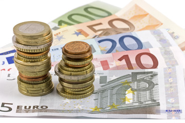 Close-up of Euro banknotes and coins