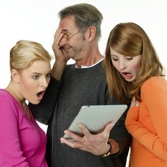 Father and his daughters are shocked by surfing on the internet