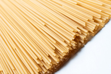 raw pasta on a white background
