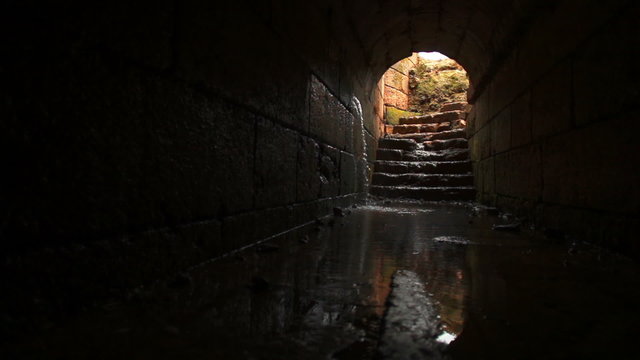 Stock Video Footage of a tunnel filling with water at the Palace of Agrippa in Israel.