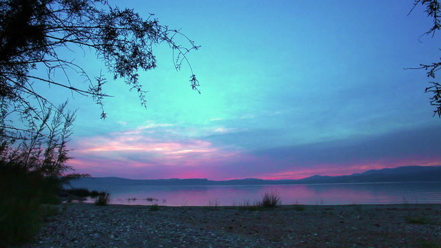 Stock Video Footage of the sky at sundown over the Sea of Galilee in Israel.