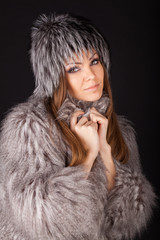 beautiful smiling woman in furs