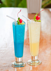 blue tropical cocktail and lemon soda