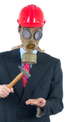 Business man with gas mask and helmet striking with hammer © Solid photos