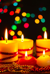 Beautiful candles and decor on wooden table on bright background