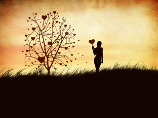 Silhouette of a girl with a heart and tree