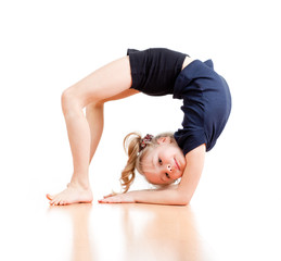 young girl doing gymnastics over white background