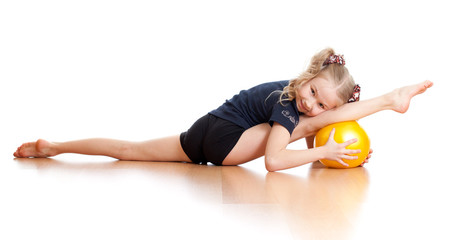 young girl doing gymnastics over white background