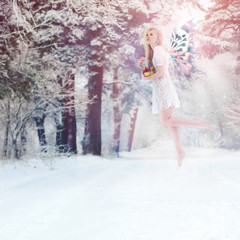 Beautiful girl posing in a winter forest