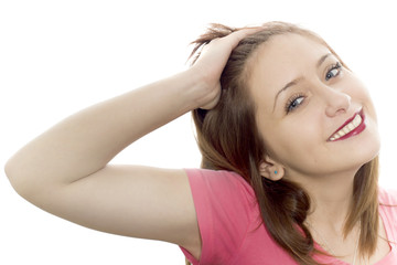 Naklejka premium The portrait of the girl on a white background which smiles