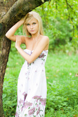 portrait of a beautiful girl in a green garden