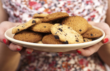 woman with plate of cookies