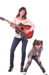 young beautiful mother and her little daughter with guitar