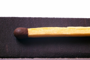 Match on coarse surface of matchbox.