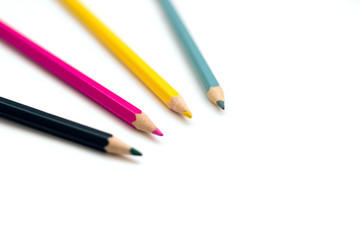 Set of four colorful crayons on white background