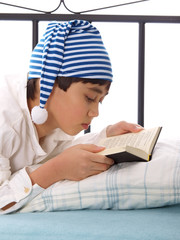 boy in nightshirt and sleeping cap