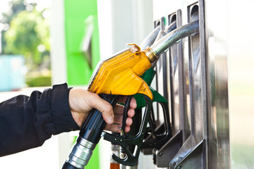 Man at gasoline pump