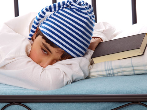 boy in nightshirt and sleeping cap