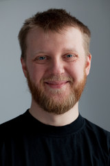 Fototapeta premium Young upbeat guy with a beard