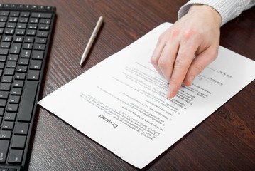 Signing contract by businessman
