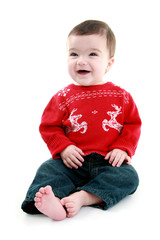 Laughing baby wearing festive jumper