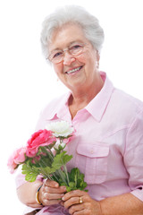 senior woman with a bunch of flowers