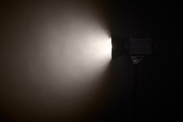 Theater spotlight over black background