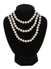 Pearl necklace on black mannequin isolated on white background