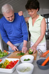Older couple preparing a meal
