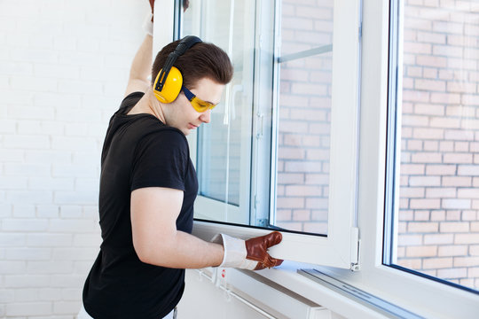 Man Worker Mounting Window