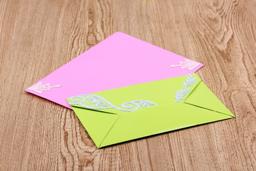 Color envelopes on wooden background