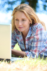 woman with laptop outdoors