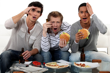 Group of friends watching a football game