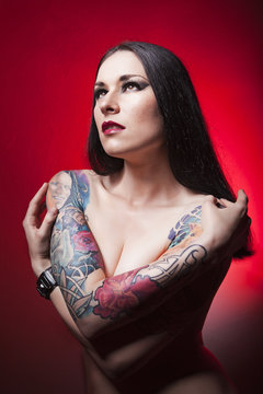 beautiful tattooed girl. red