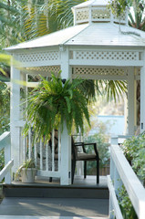 Inviting Gazebo outside in a southern style garde.