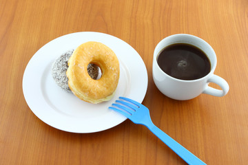Sugar and chocolate donut on breaking time.