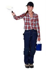 Woman with paint  pot and roller brush