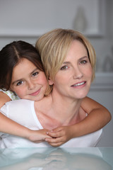 mother and daughter embracing