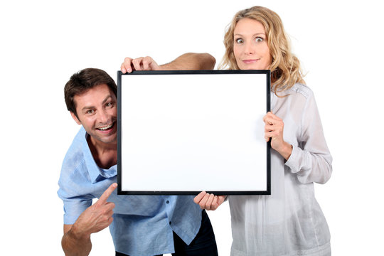 Couple Holding Blank Picture Frame