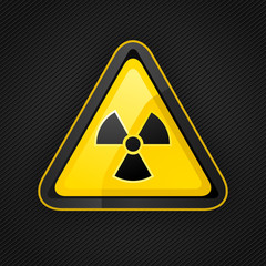 Hazard warning triangle radioactive sign on a metal surface