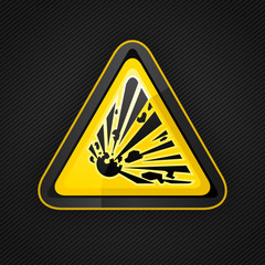 Hazard warning triangle explosive sign on a metal surface
