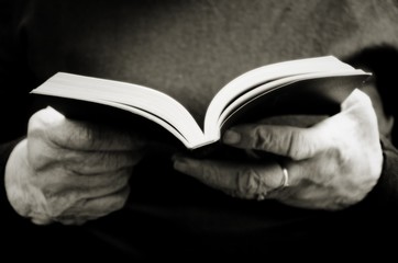 old woman reading the bible