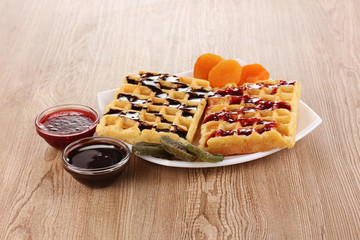 Sweet waffles with jam and chocolate