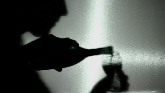 Alcohol intake. A silhouette