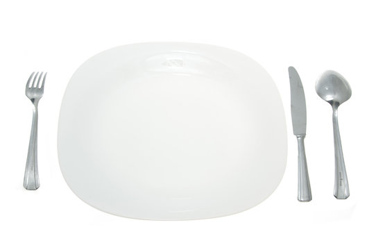 Cutlery and white plate