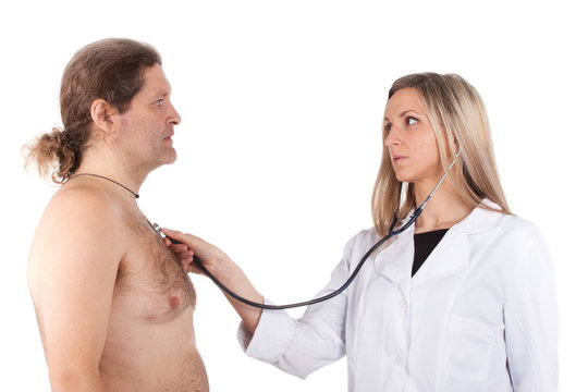 doctor examines man's chest