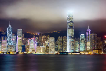 Nighttime view of Hong Kong skyline over Victoria harbor