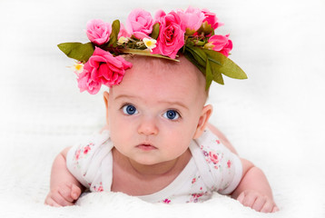 a large portrait of a cute little girl with a beautiful flower