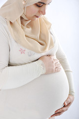 Arabic Muslim pregnant woman wearing traditional clothes