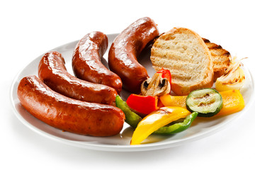 Grilled sausages, bread and  vegetables